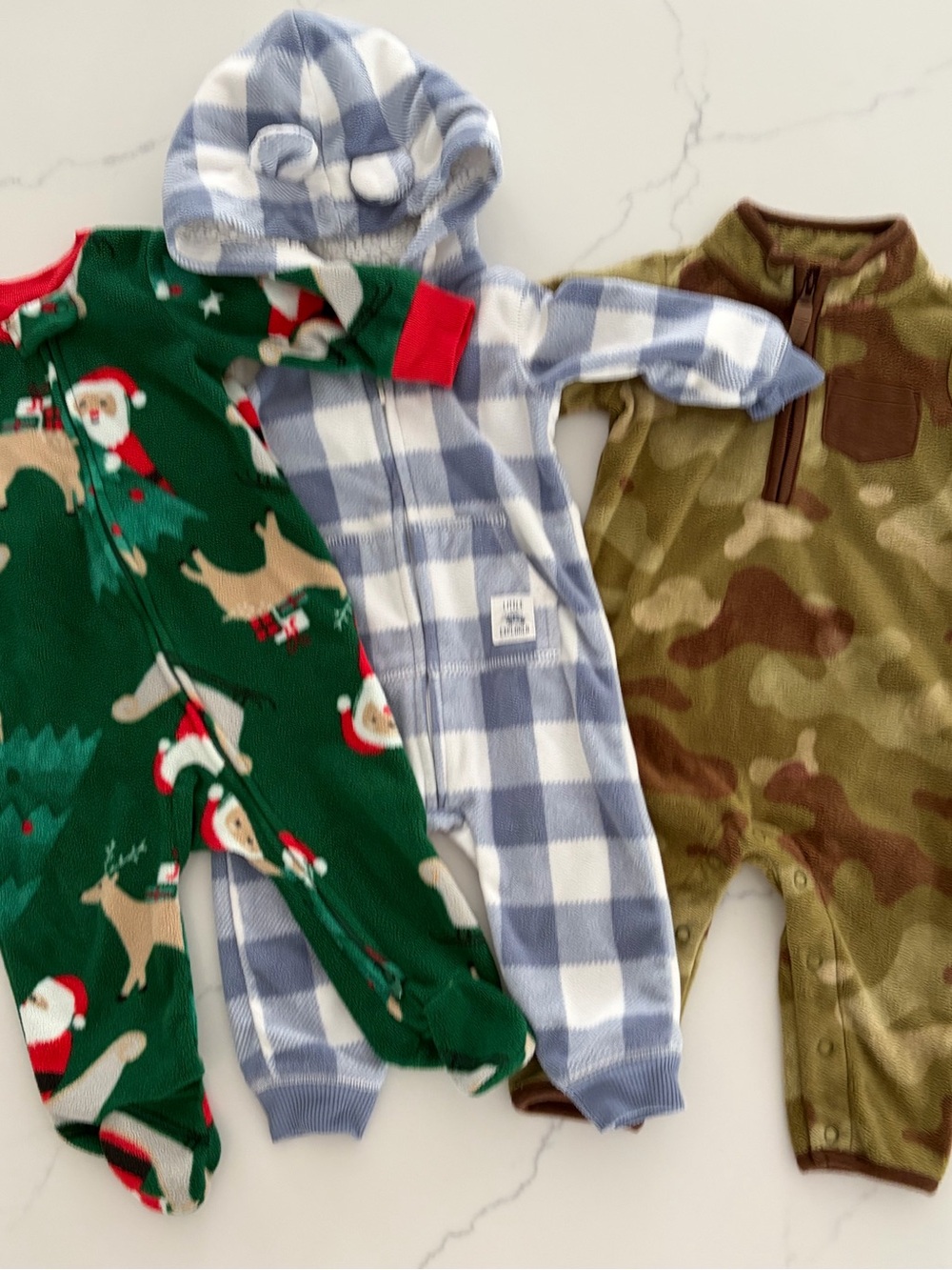Carters 6 mo baby bundle of warm fleeced onesies. Like new. Very soft and cuddly